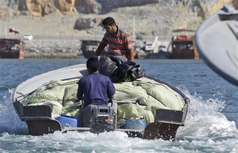 Iranian smugglers leave Khasab, Oman, loaded with goods to cross the Strait of Hormuz to reach Iranian coastal areas on Jan. 18.